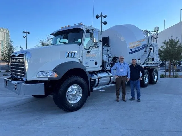 Omar Nunez and Clinton Campbell in front of Mixer Truck
